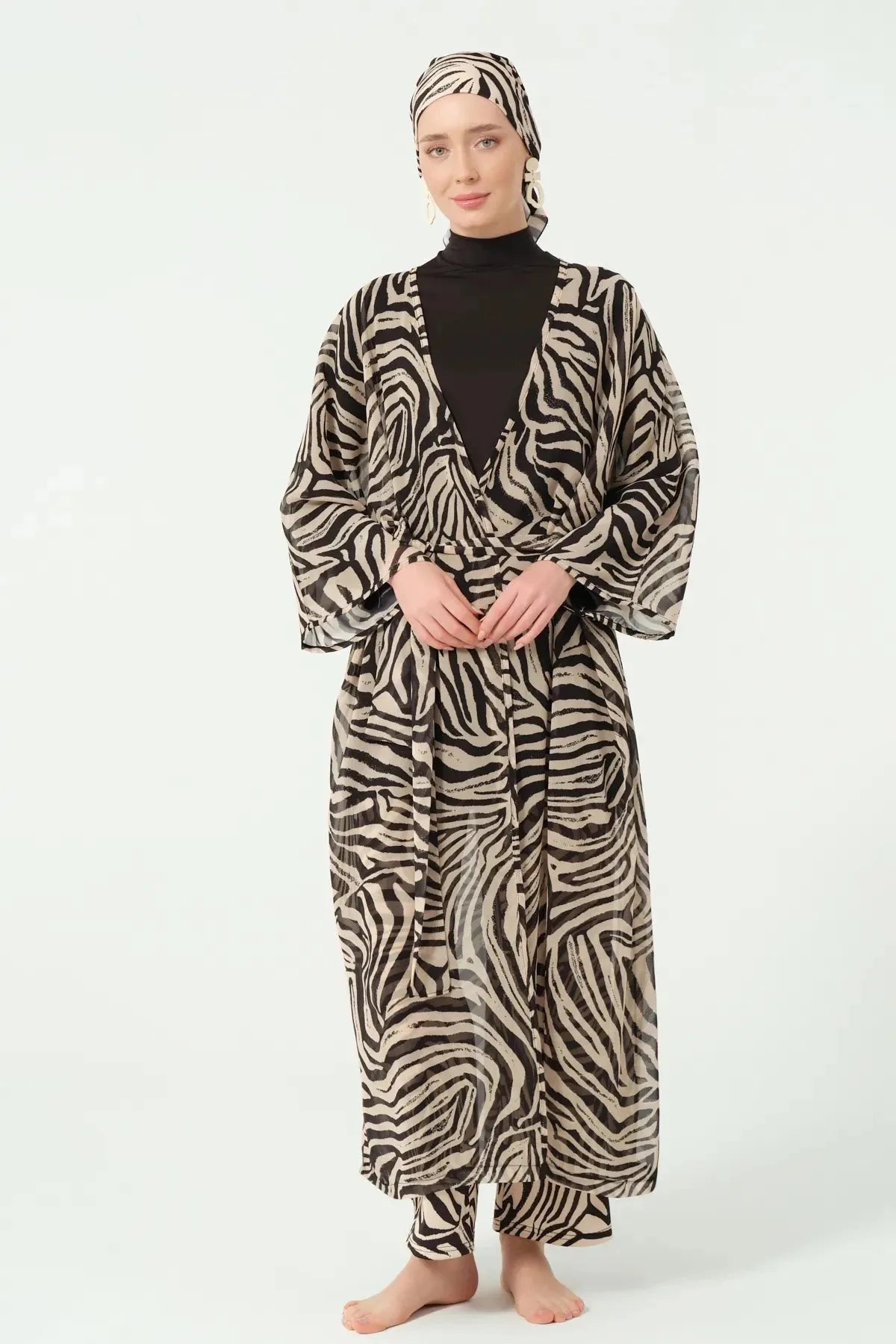 Model wearing zebra print sheer kimono with belt tied, front view.