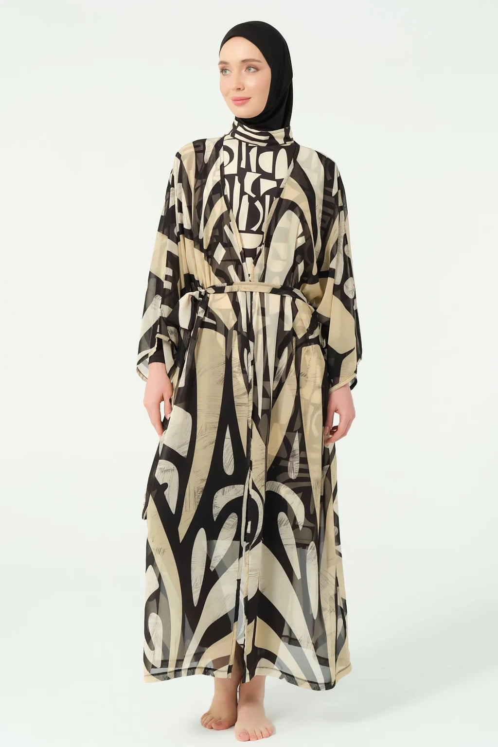 Model standing in black and beige abstract print sheer kimono.