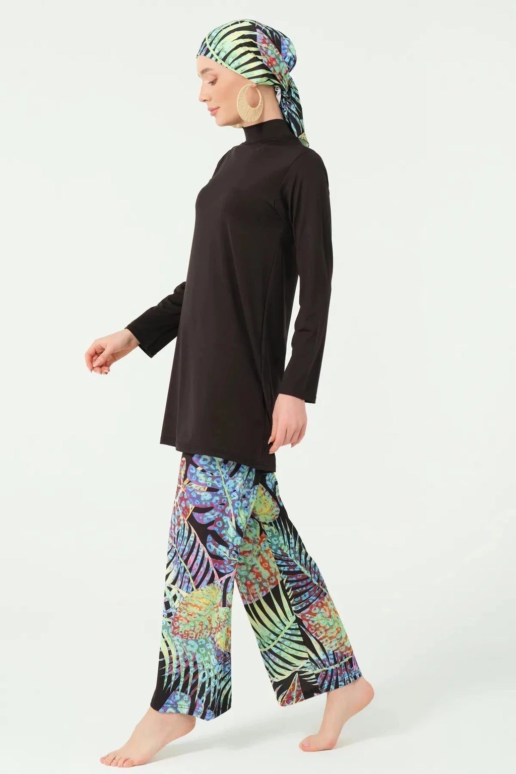 Black burkini top with tropical print swim pants, side view, without kimono.