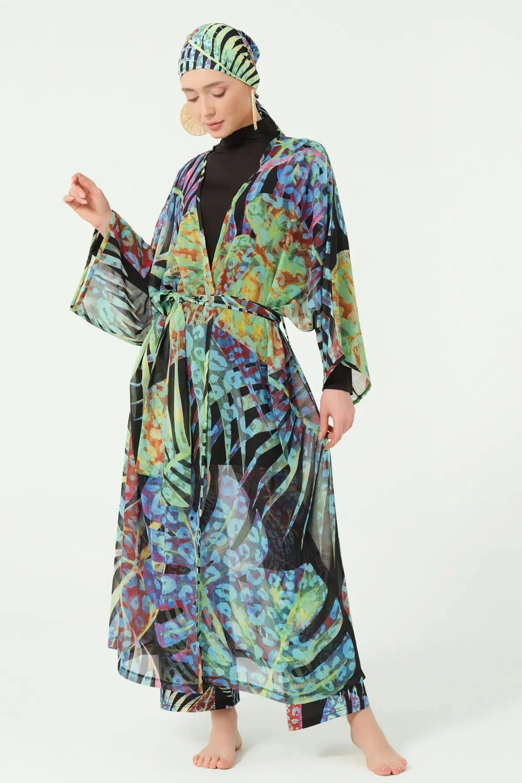 Full length view of black burkini with tropical print kimono and headscarf.