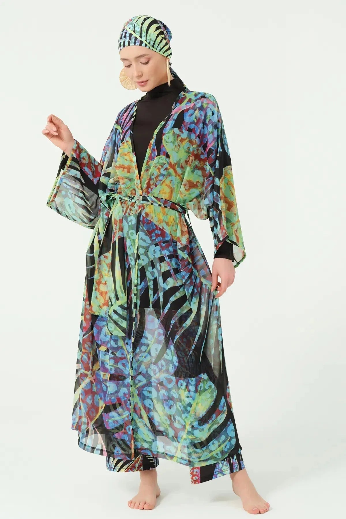 Full length view of black burkini with tropical print kimono and headscarf.