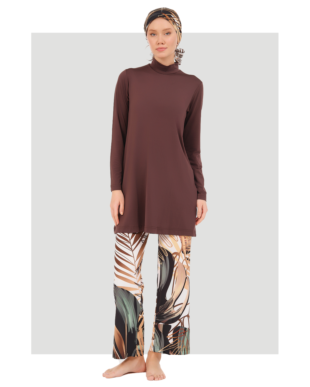 Full-length view of rich brown modest swimwear set with botanical print.