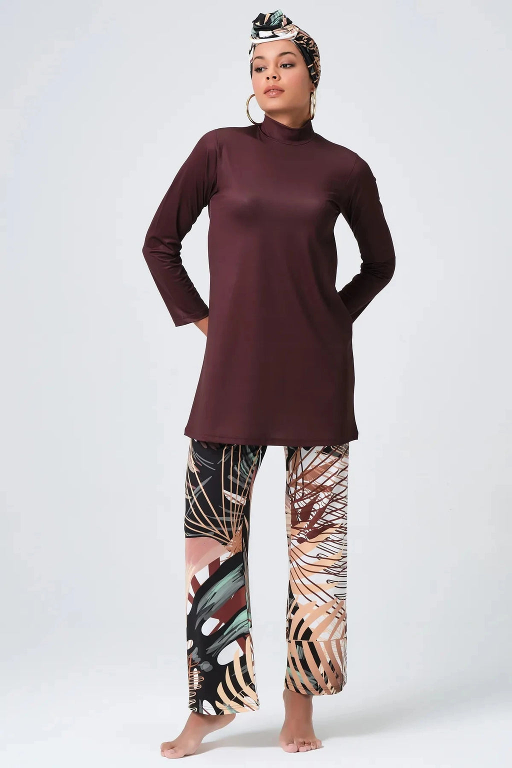 Full-length view of rich brown modest swimwear set with botanical print.