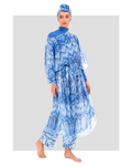 Woman in blue geometric print sheer kimono over modest swimwear.
