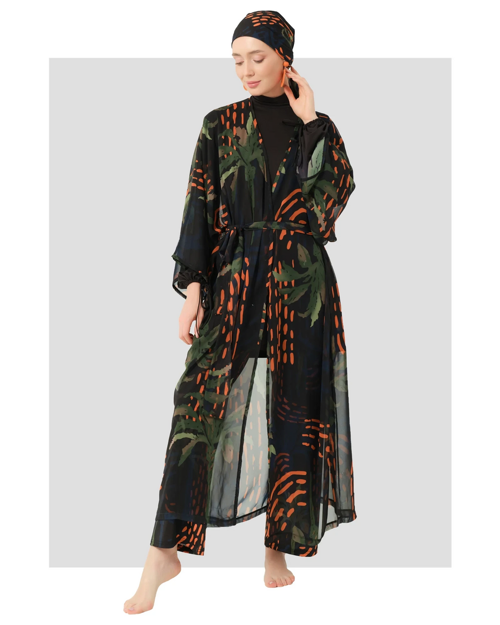 Woman in tropical palm print modest kimono set, front view.