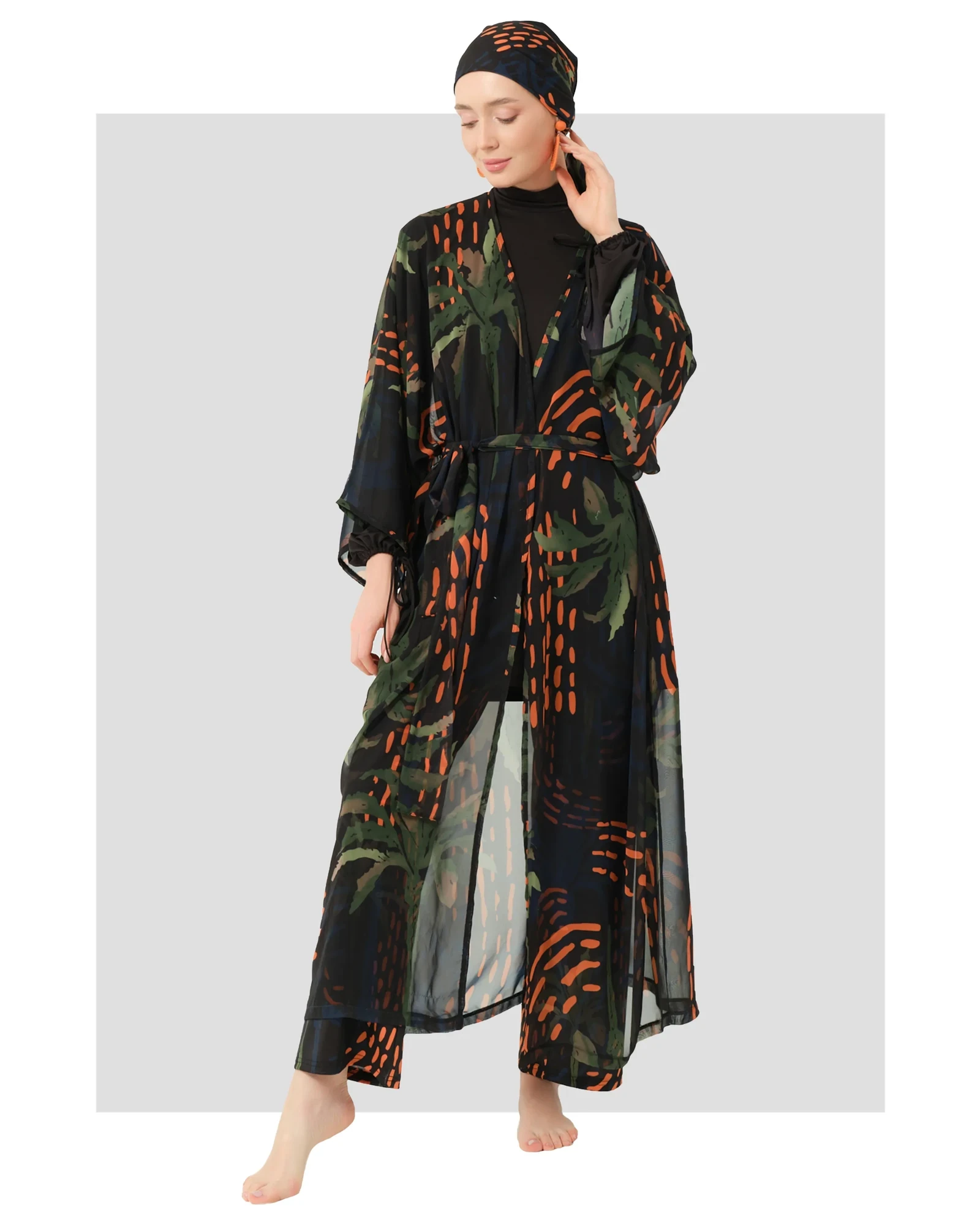 Woman in tropical palm print modest kimono set, front view.