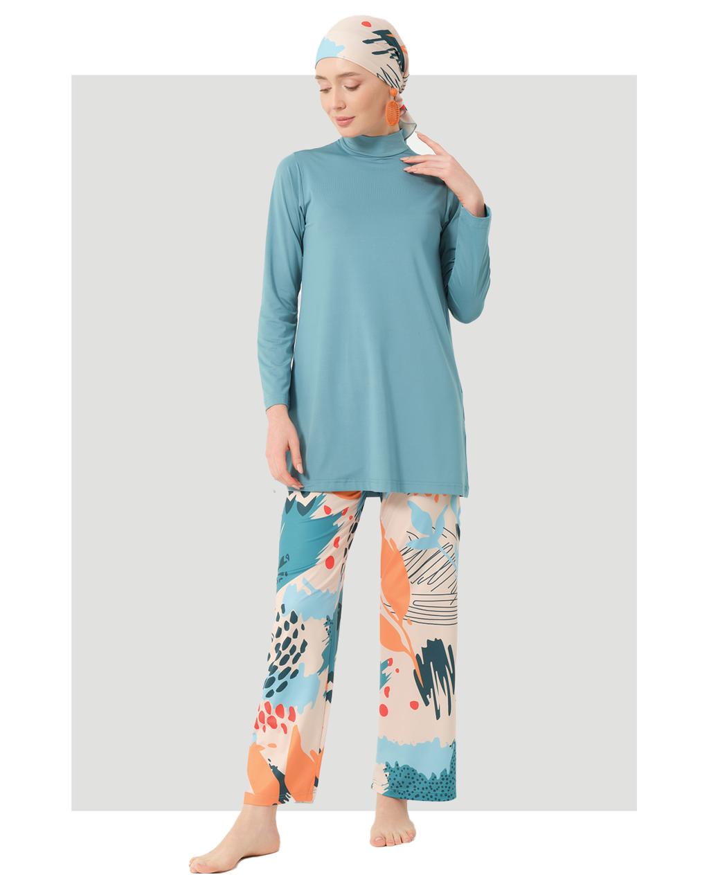 Persian green modest swimwear set with abstract print pants, front view.