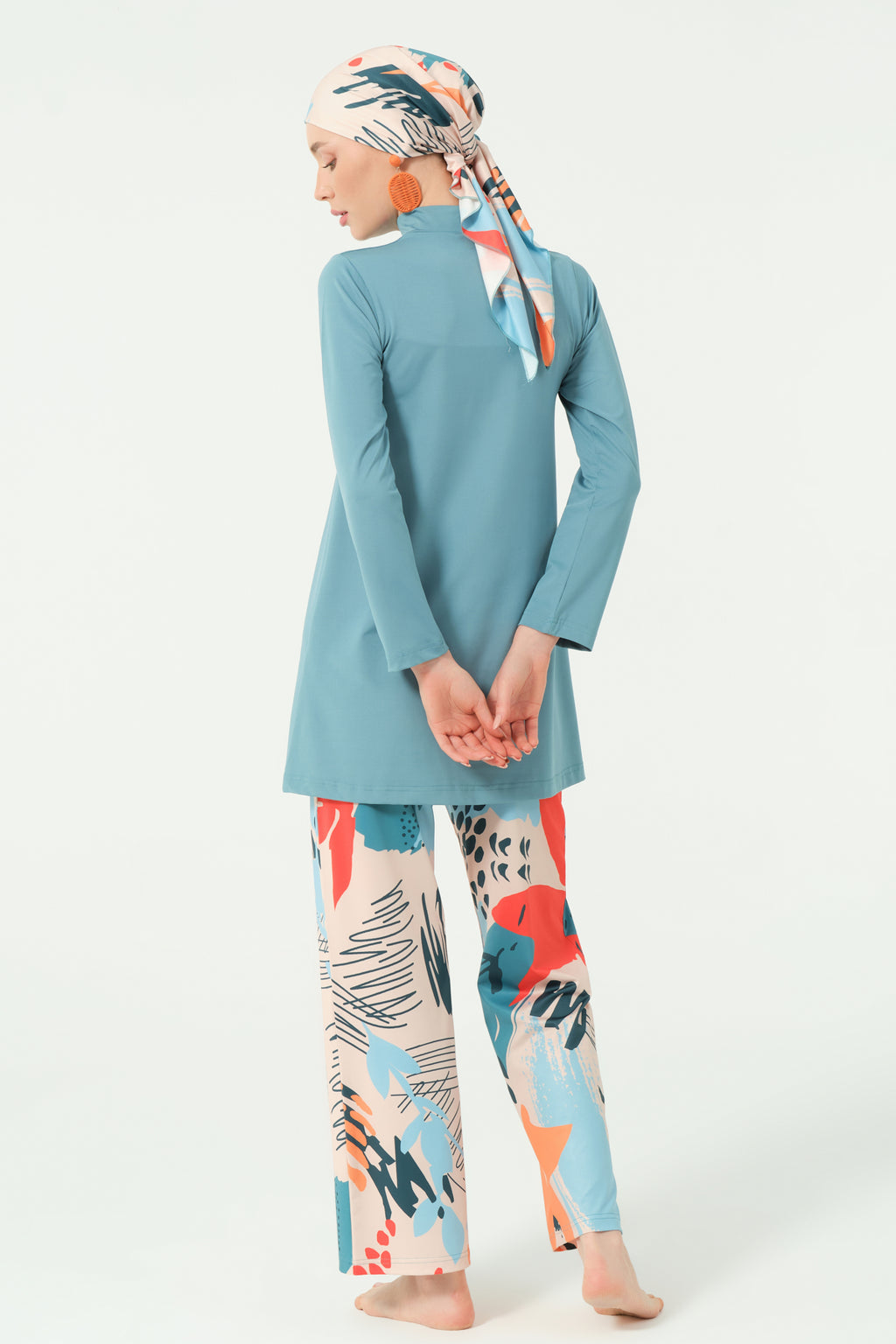 Persian green modest swimwear set with abstract print pants, back view.