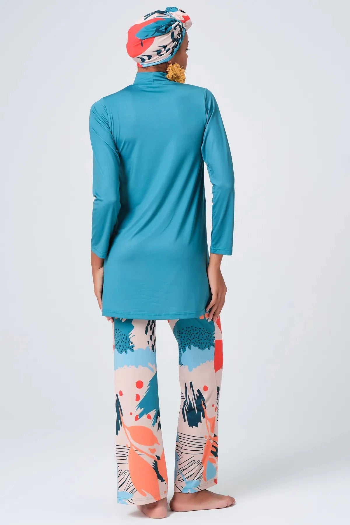 Persian green modest swimwear set with abstract print pants, back view.